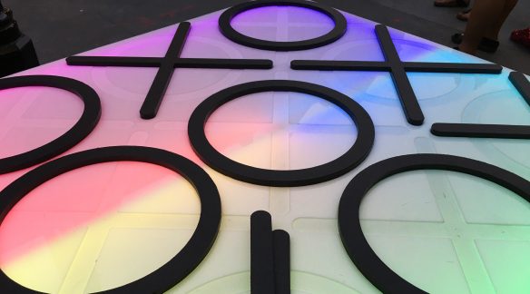 A giant neon Tic-Tac-Toe board