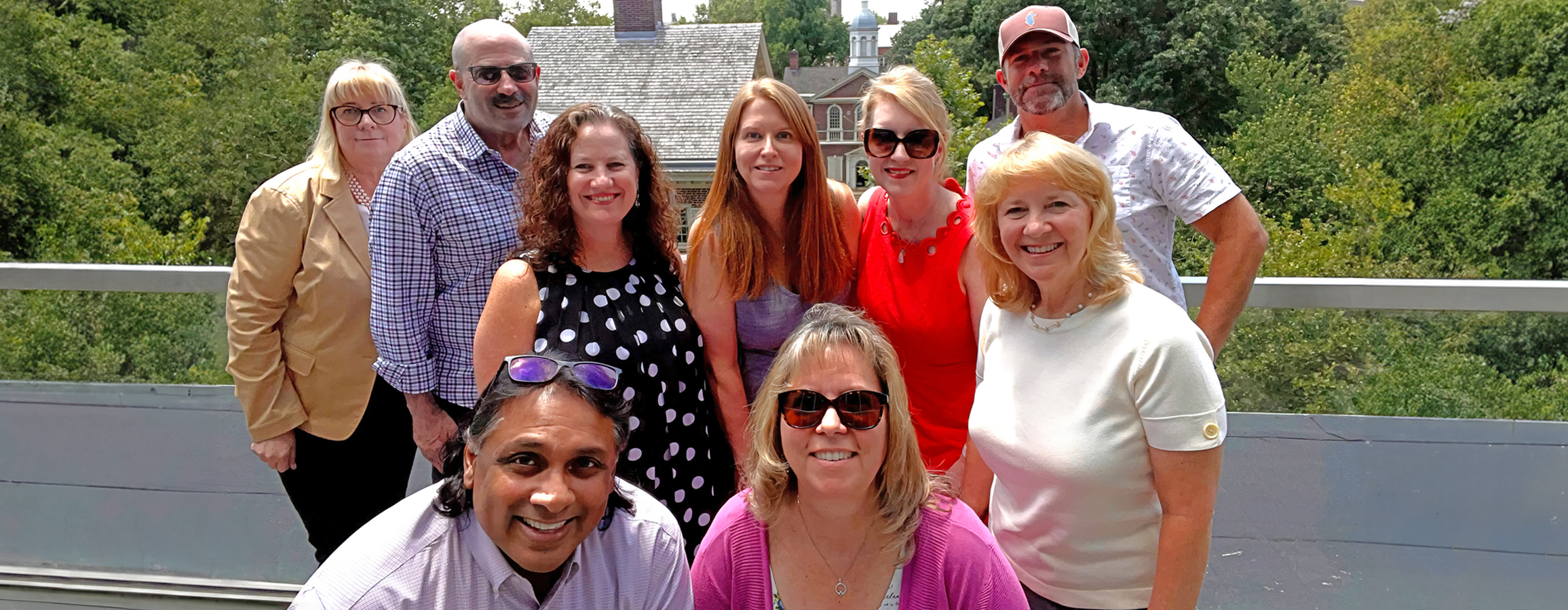 BNO staff standing on the balcony of the Philadelphia office.