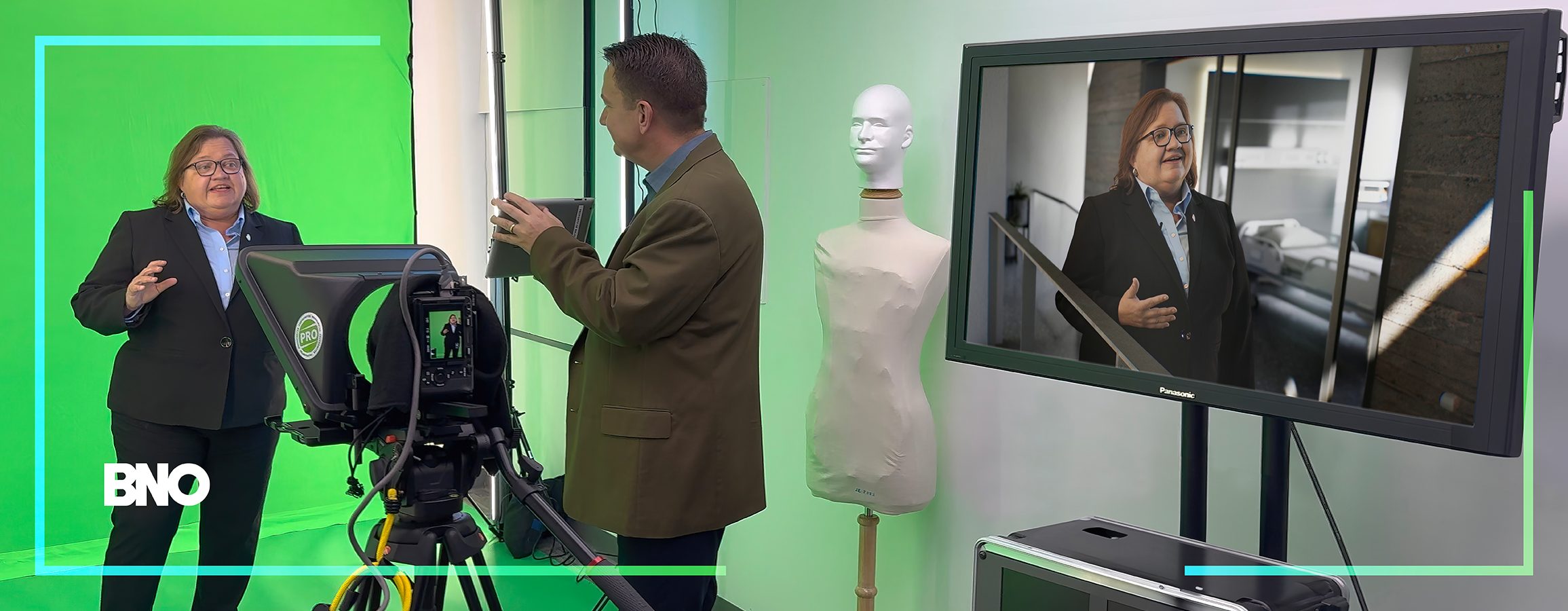 George, right, directing in the Virtual Studio.