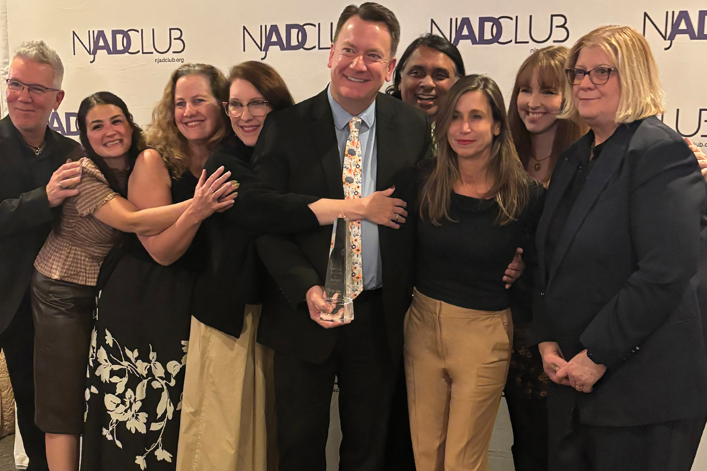 George Jackus is surrounded by team members from Baldwin & Obenauf, Inc. (BNO) who joined him to celebrate his induction into the Advertising Hall of Fame of New Jersey recently at The Highlawn in West Orange, NJ. Representing BNO from left to right are Marc Goodinson, Faith Earl, Sheri Wachenheim, Trista Walker, George Jackus, Abey Abraham, Grace Witte, Emily Kopf, and Rachelle Powell.